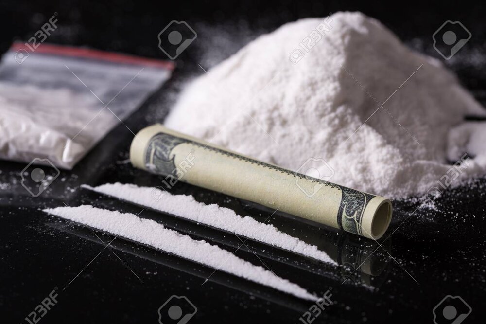 90964316-rolled-hundred-dollars-banknote-two-lines-and-pile-of-cocaine-on-black-background-closeup.jpg