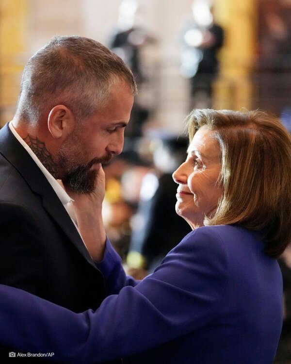 Speaker Pelosi with Michael Fanone, the DC police officer who suffered burns, a heart attack & traumatic brain injuries on Jan 6. Palpable mutual appreciation ….jpg