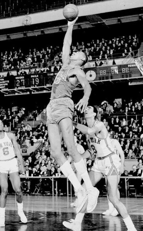 Wilt Chamberlain dunking catching ball.jpg